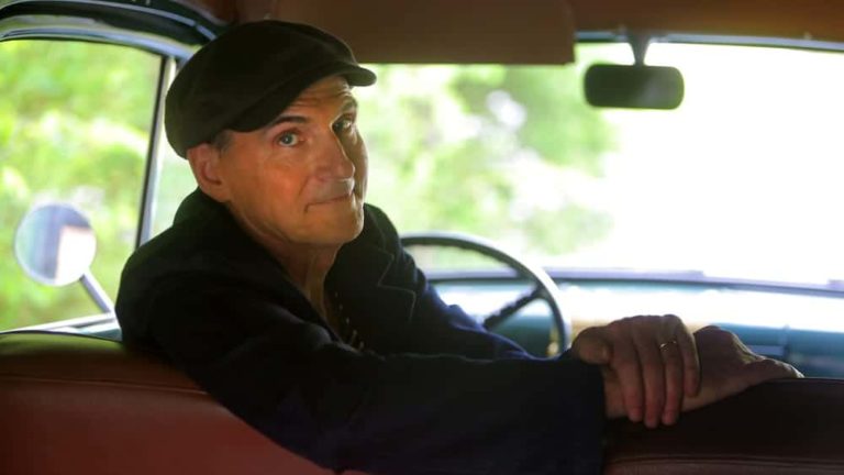 James Taylor appears on the grounds of his Lenox home, in a 1950 Ford panel truck that had at one time seen use as an ambulance.