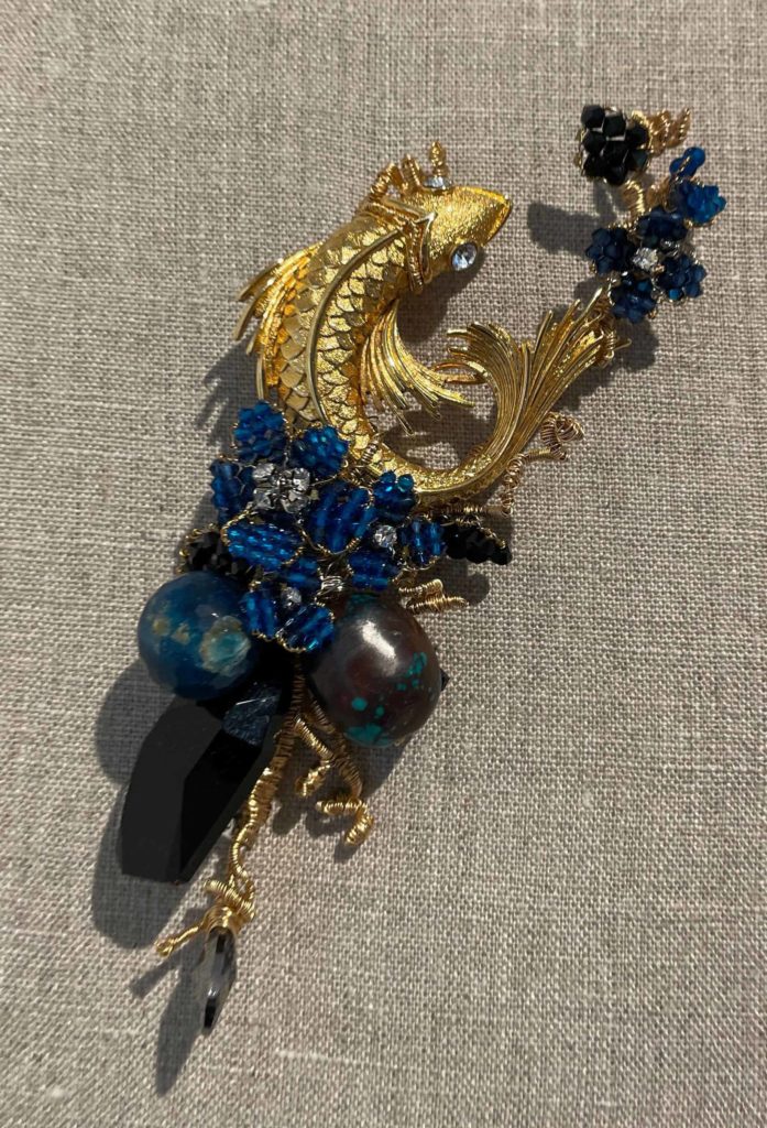 Jewelry artist Mindy Lam creates whimsical original pins and pendants with natural forms, vintage creatures and beaded blossoms, shown in Flights of Fancy at the Berkshire Botanical Garden.