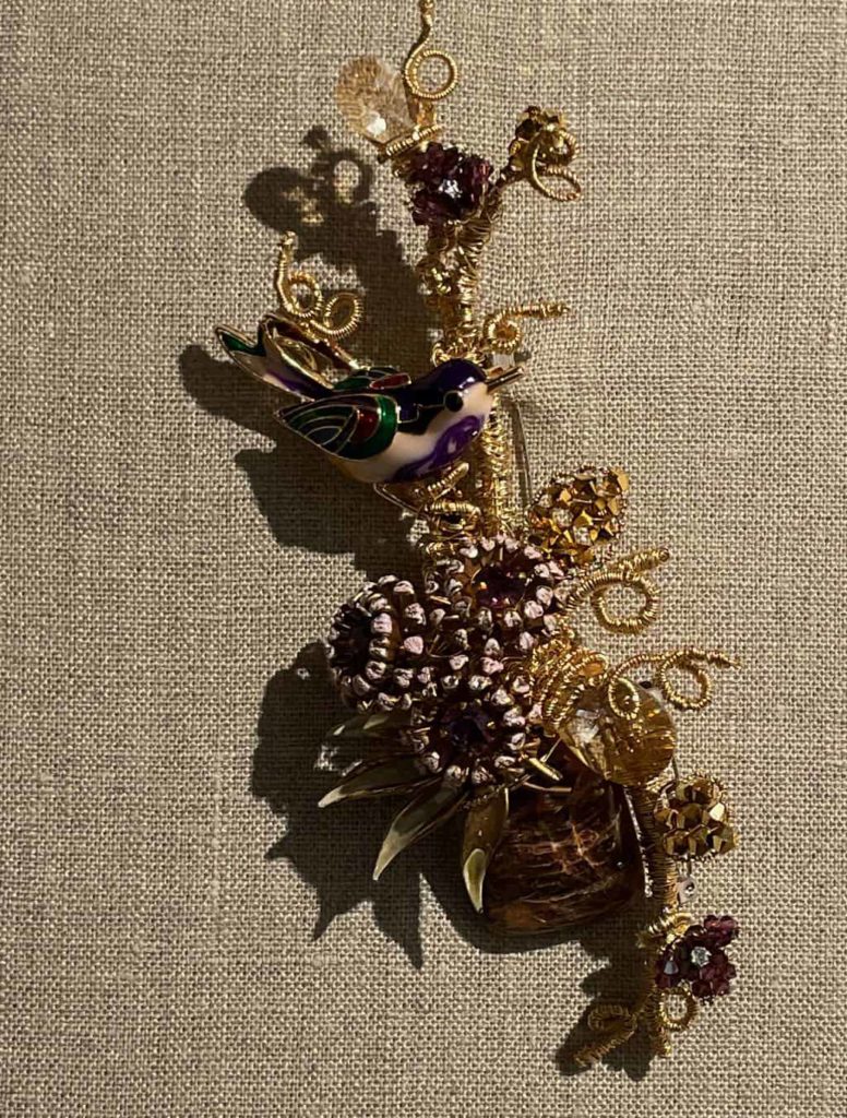 Jewelry artist Mindy Lam creates whimsical original pins and pendants with natural forms, vintage creatures and beaded blossoms, shown in Flights of Fancy at the Berkshire Botanical Garden.