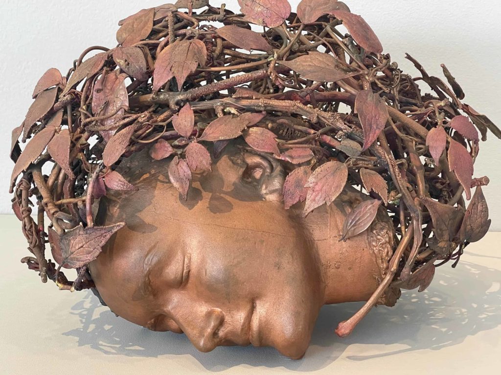 Claude Lalanne's sleeping woman smiles in her crown of vines in Nature Transformed at the Clark Art Institute.