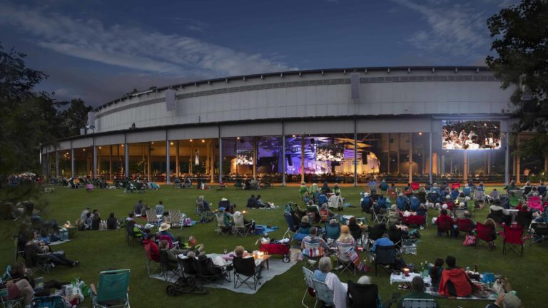 Families on the lawn at Tanglewood on a summer night listen to the Boston Symphony Orchestra. Press photo courtesy of the BSO.