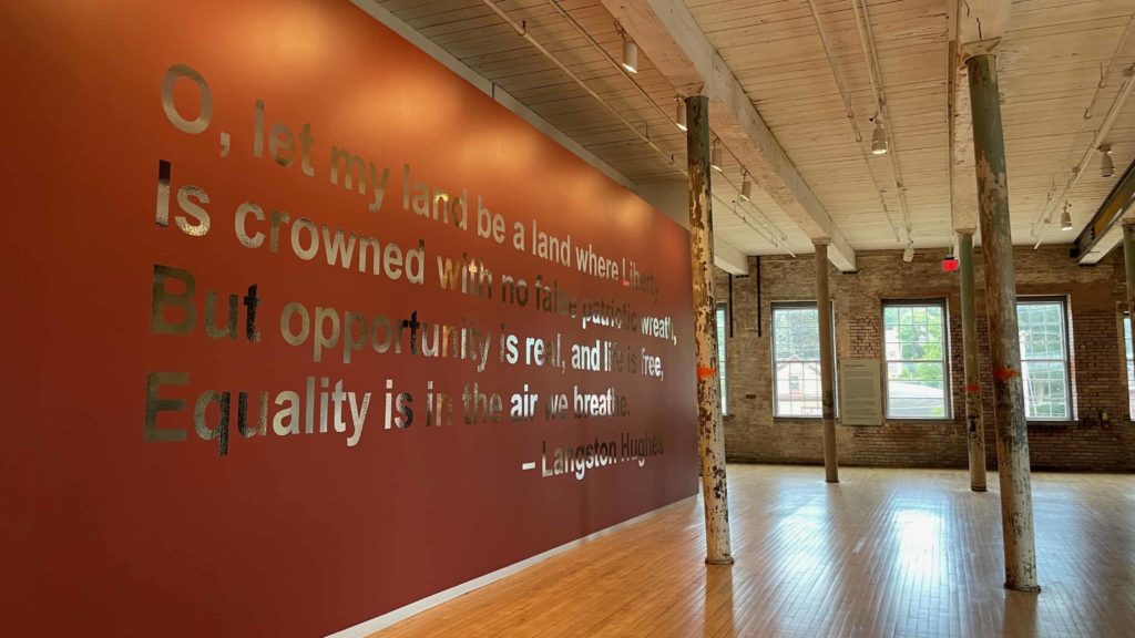 In Erre's 'Us and Them' exhibit at Mass MoCA a verse by Langston Hughes gleams on the wall.