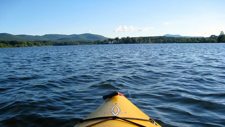 A yellow kayak glides on Onota Lake in Pittsfield. Photo courtesy of the artist.