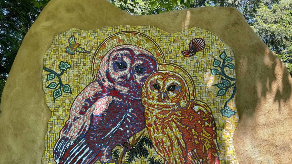 Peter Gerakaris' owl mosaic glimmers in dappled shade at the Berkshire Botanical Garden.