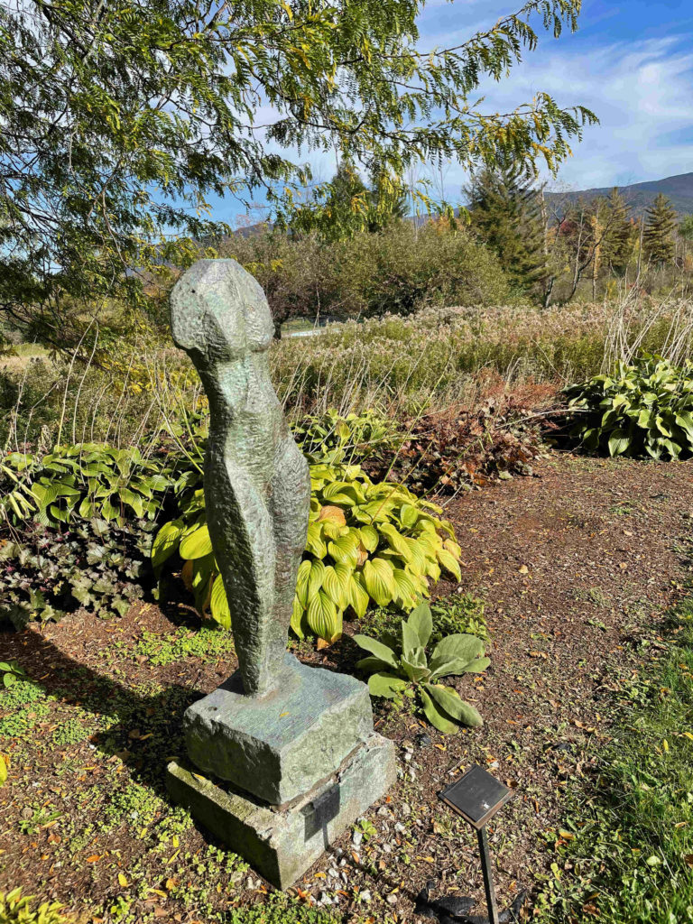 Bronze sculpture and fall maples brighten the garden at Field Farm on a fall day.
