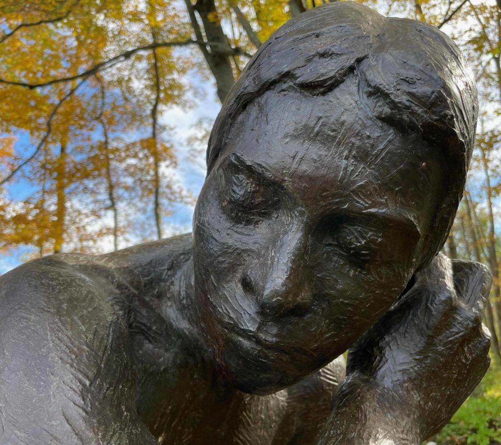 Richard M. Miller's bronze sculpture of Diane rests under the maple trees at Field Farm.