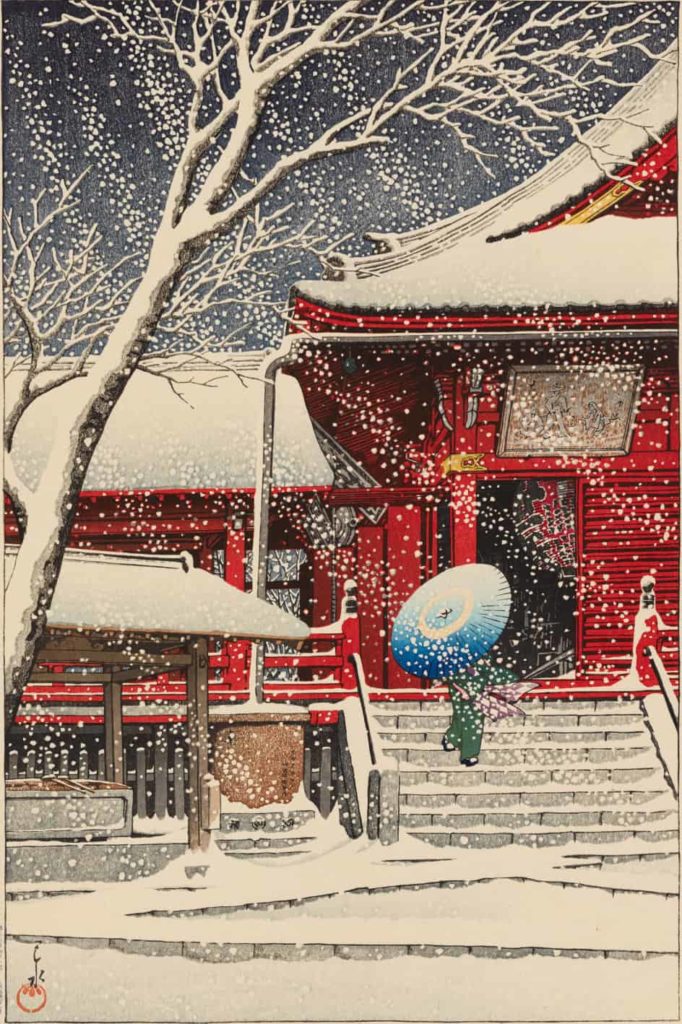 A visitor walks up the steps of a building painted deep red in Kawase Hasui's Spring Snow at Kiyomizu Hall.