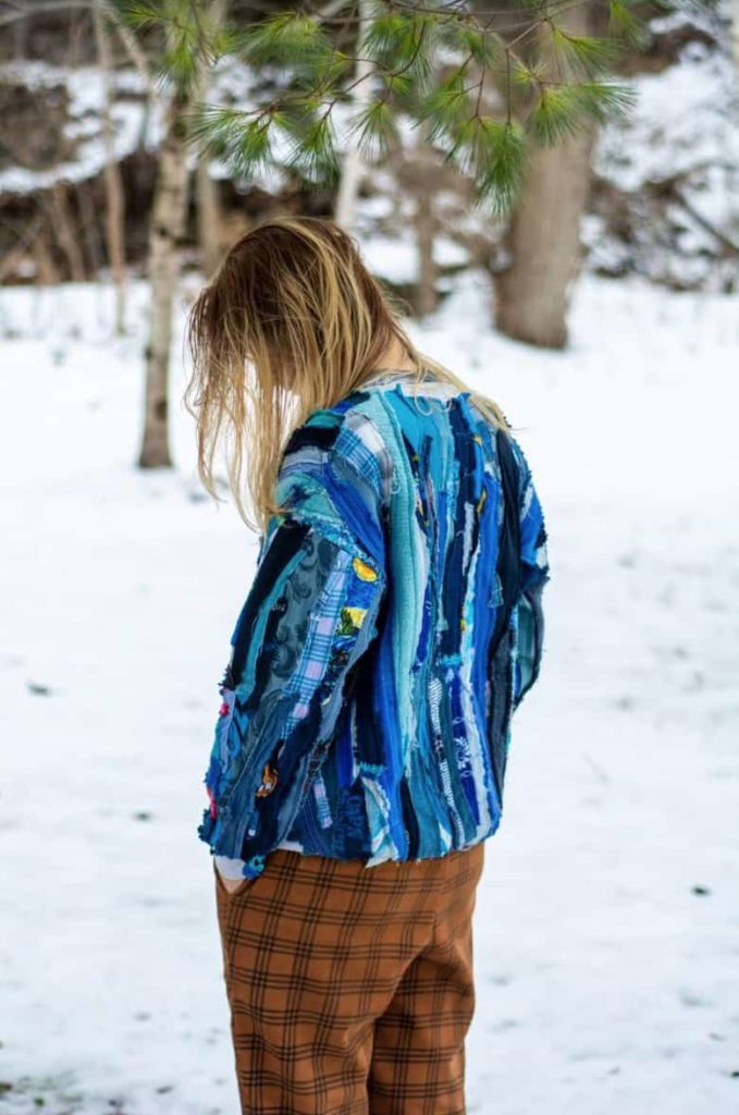 Sarah DeFusco and Andrew (Kirby) Casteel design bright upcycled clothing like this vivid blue Coogi-style sweater through their North Adams clothing brand, Wallasauce. Press image courtesy of the artists.