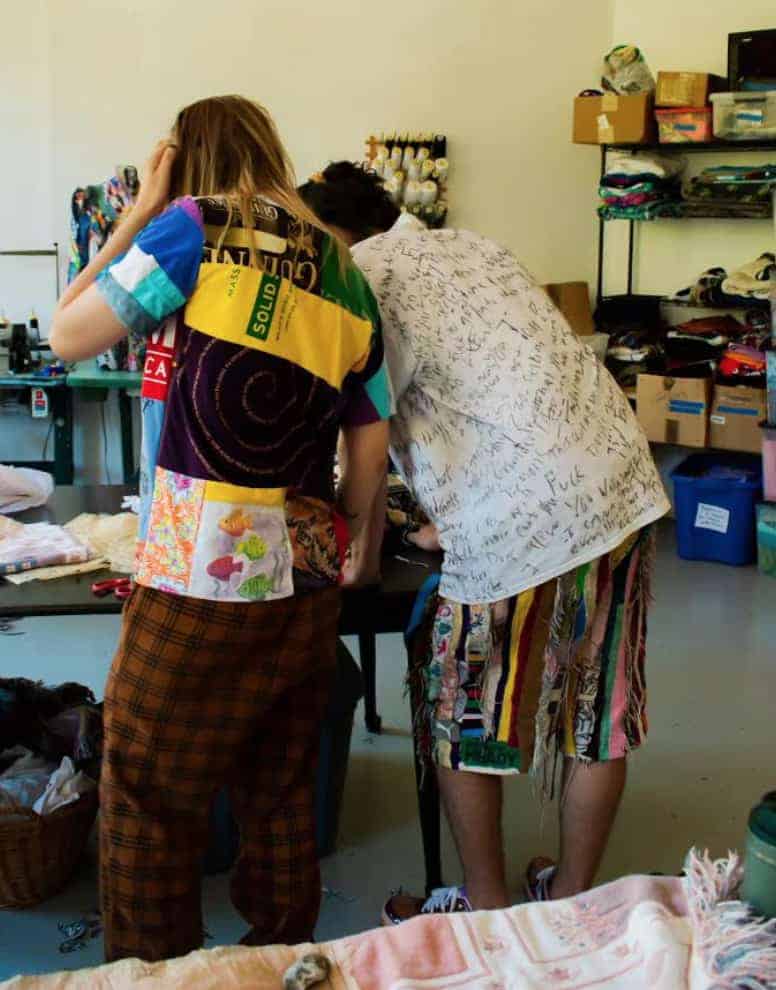 Sarah DeFusco and Andrew (Kirby) work in their Beaver Mill studio for North Adams clothing brand, Wallasauce. Press image courtesy of the artists.