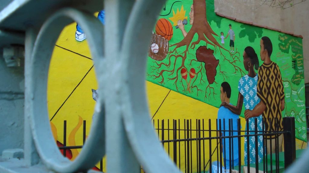 A mural shows a family with African roots in Harlem, N.Y. Creative Commons courtesy photo