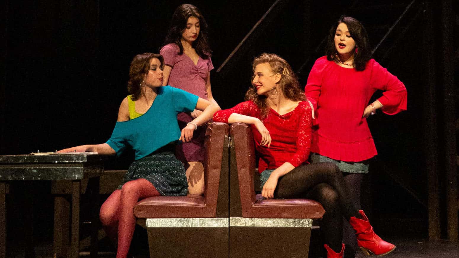 Kate Gobel as Ariel Moore, Emileigh Mickle as Rusty, Lotus Cohen as Wendy Jo and Teagan Demler as Urleen hang out at the local diner in Footloose with the Berkshire Theatre Group. Press photo courtesy of BTG.