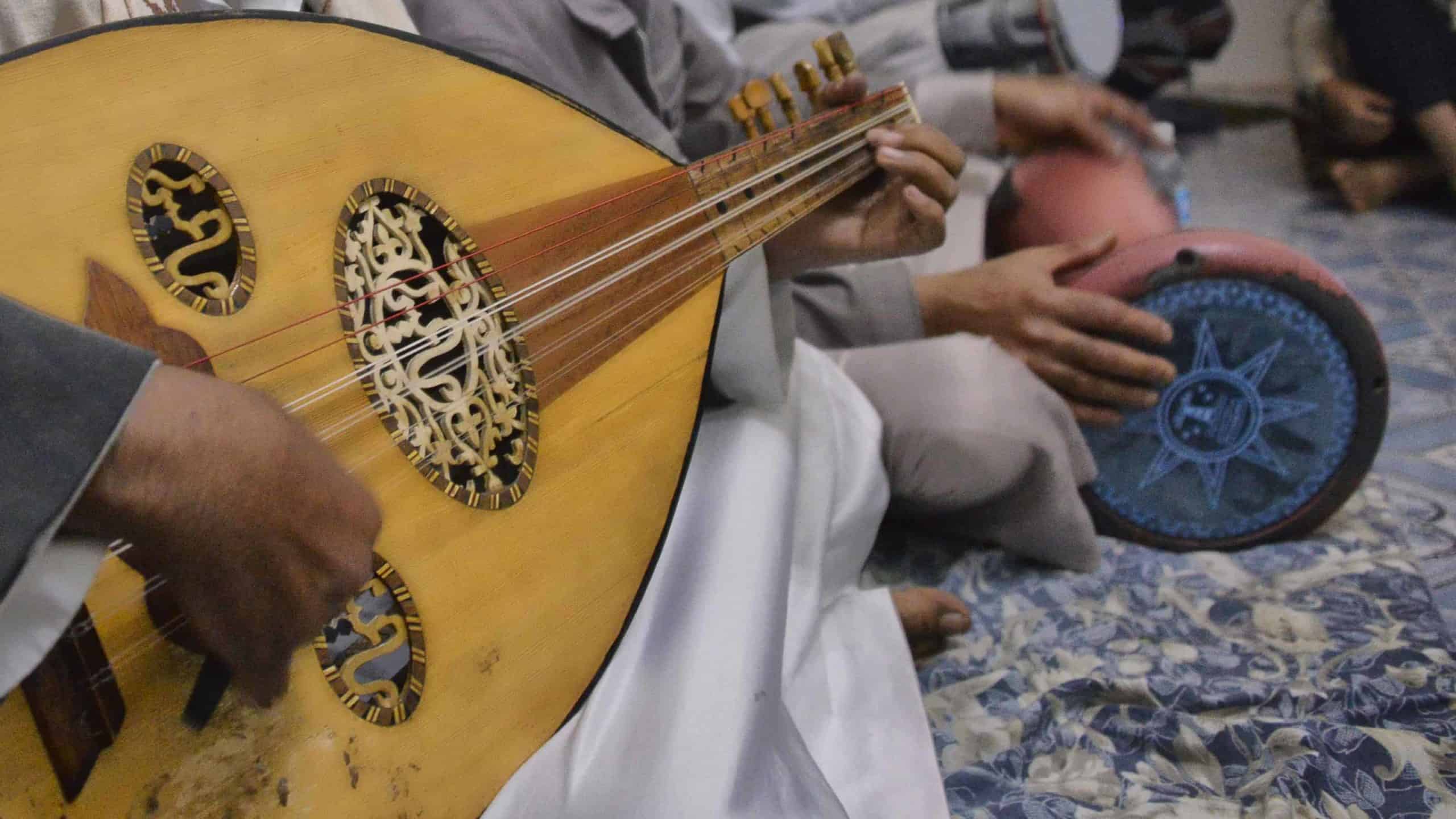 A musician in Yemen plays an Oud, an Arab stringed instrument, in an ensemble. Creative Commons courtesy photo