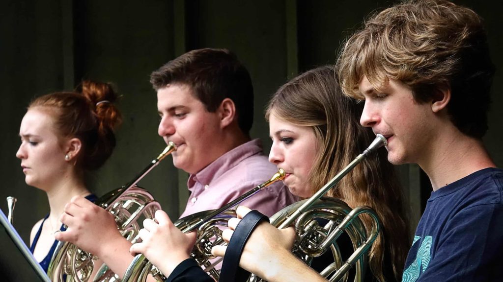 Musicians rehearse with a Boston University Tanglewood Institute horn workshop. Press photo courtesy of BUTI