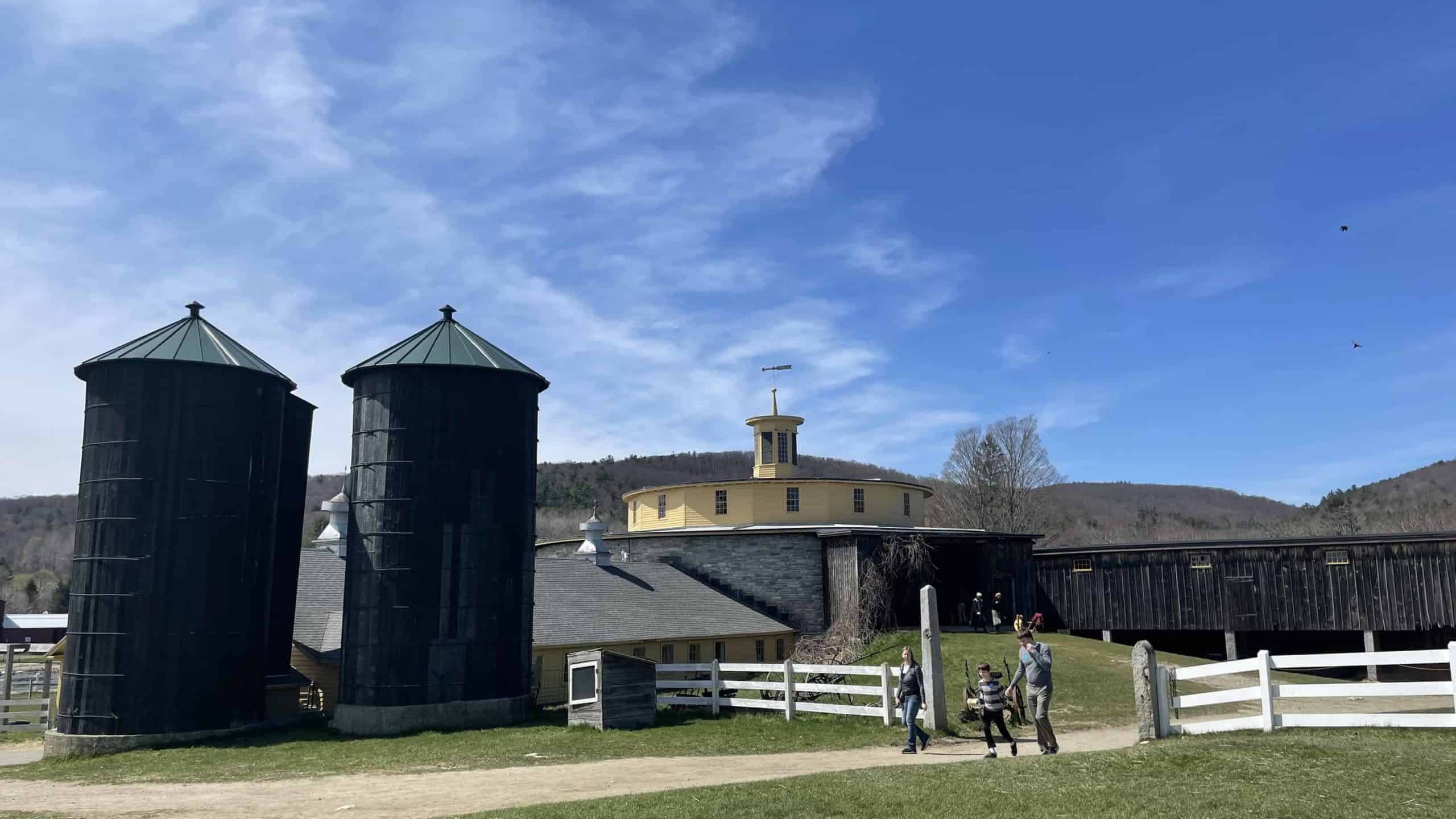The Round Stone Barn catches sunlight on a spring day at Hancock Shaker Village.