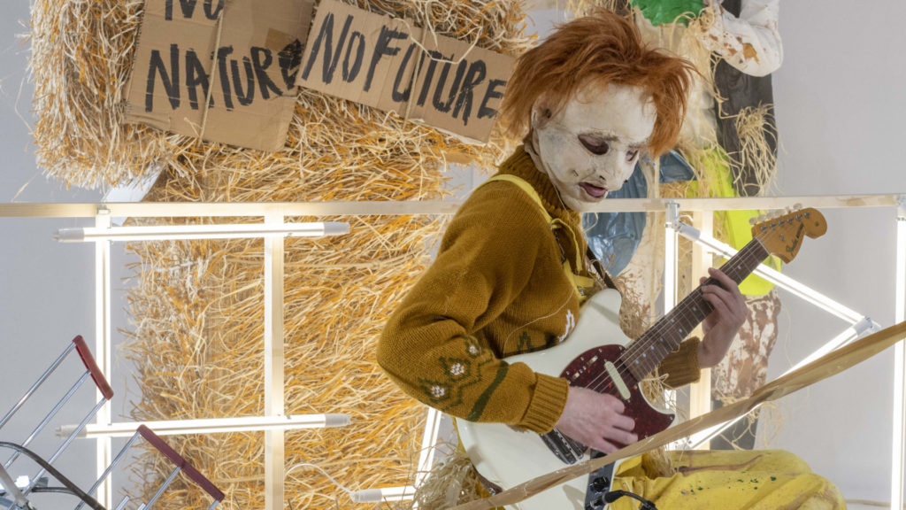 A performer in Philippe Quesne's Farm Fatale appears as a scarecrow playing an electric guitar. Press image courtesy of Performance Space 21