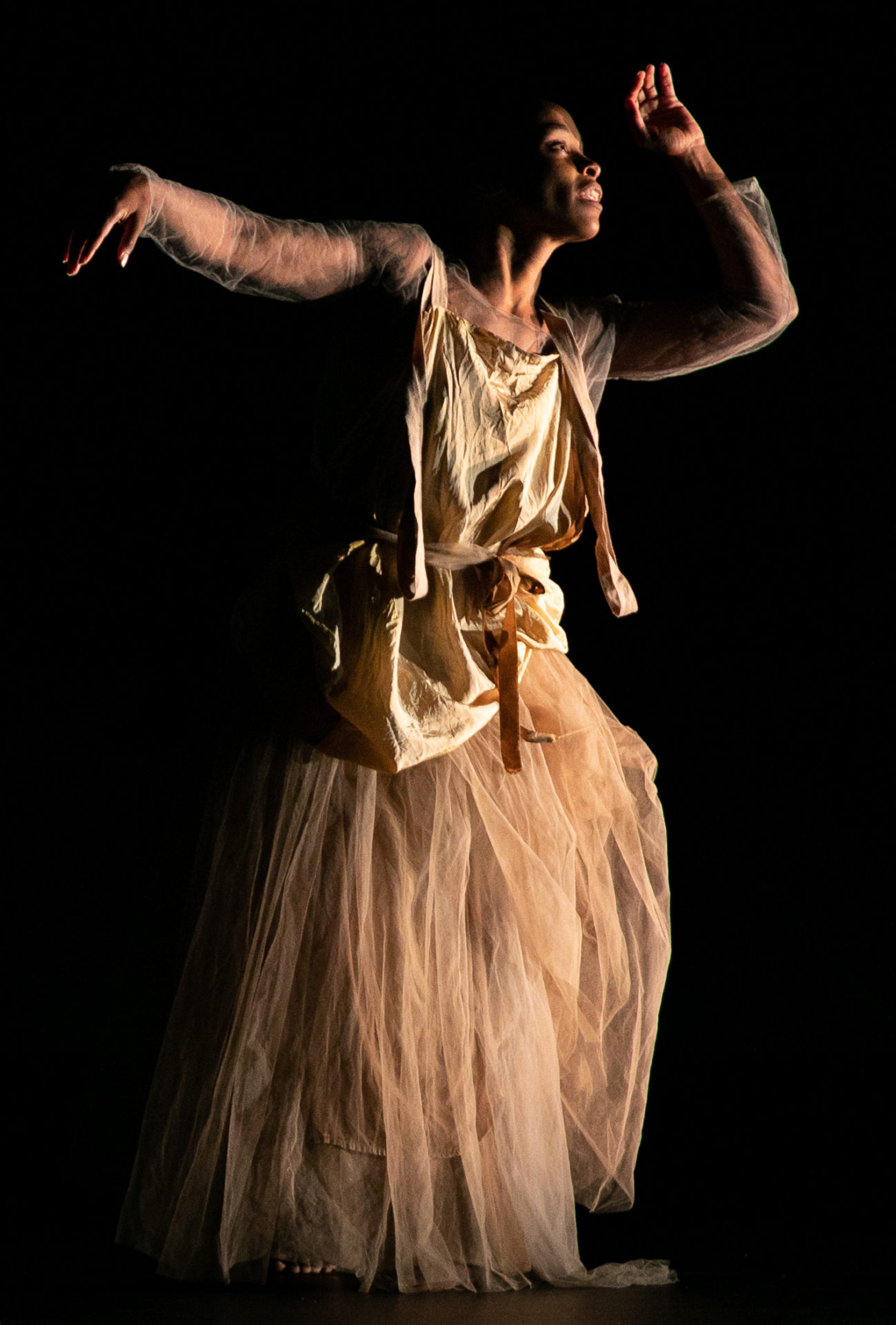 Jasmine Hearn, acclaimed dancer and poet, musician and performance artist, dances with light at Jacob's Pillow Dance Festival. Press photo courtesy of the Pillow