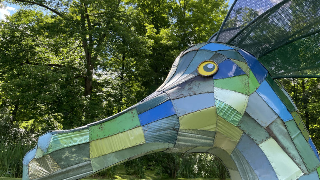 Cecelia, a sea serpent made of vintage scrap metal, glides on the lawn in Edith Wharton's gardens in the annual outdoor sculpture show.