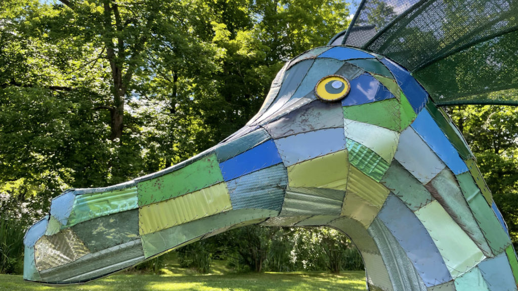 Cecelia, a sea serpent made of vintage scrap metal, glides on the lawn in Edith Wharton's gardens in the annual outdoor sculpture show.