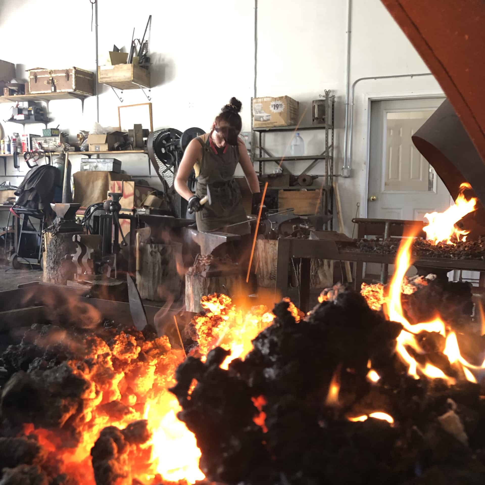 The forge glows in the annual festival of fire as a smith shapes her work on the anvil at Salem Art Works. Press photo courtesy of SAW