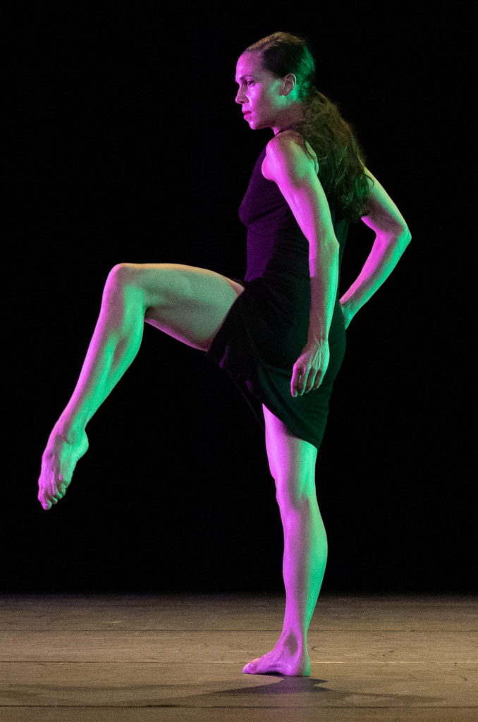 A Hubbard Street Dance Chicago dancer lifts a foot, poised at Jacob's Pillow. Press photo courtesy of Jacob's Pillow