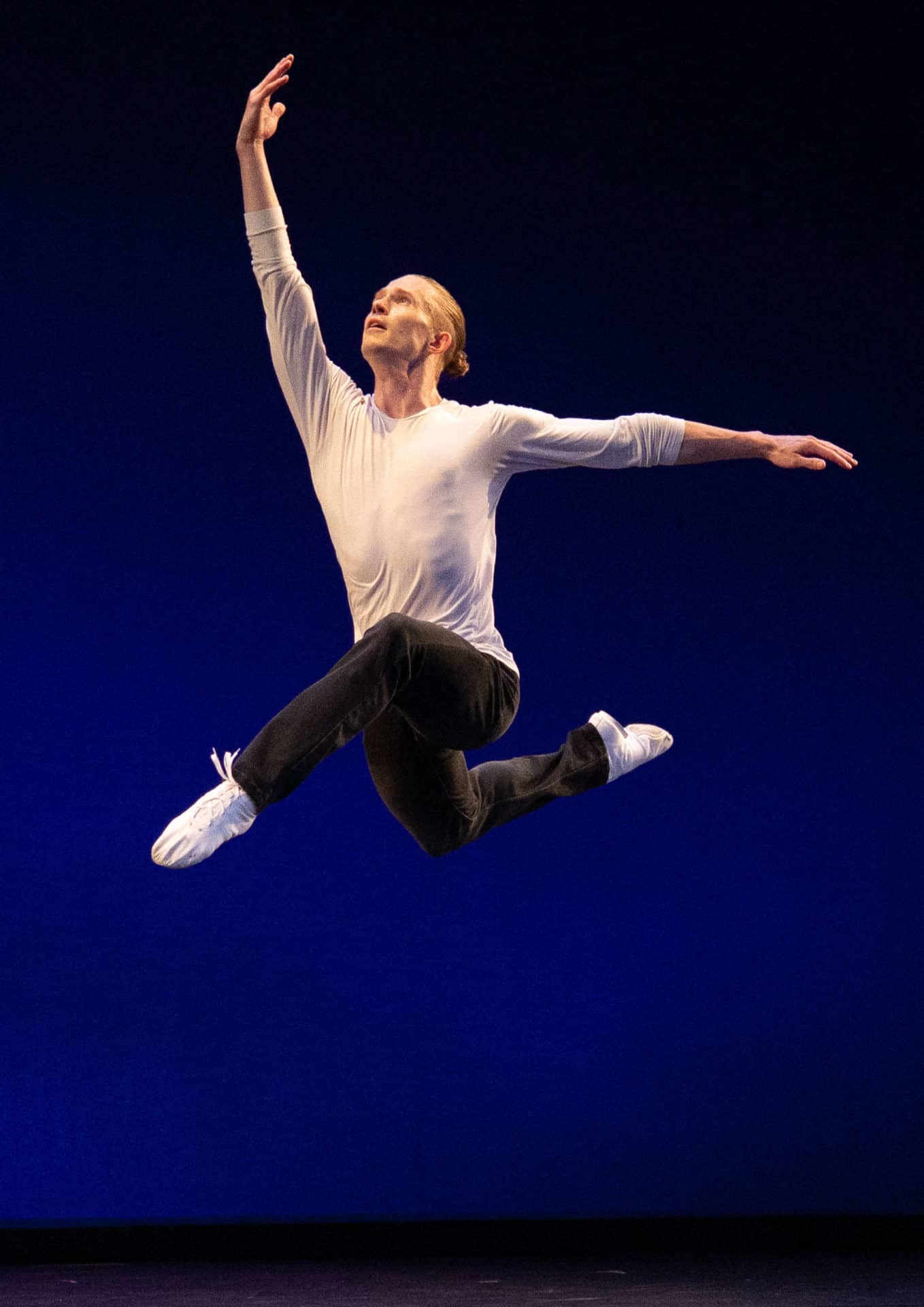 A Hubbard Street Dance Chicago dancer leaps high at Jacob's Pillow. Press photo courtesy of Jacob's Pillow