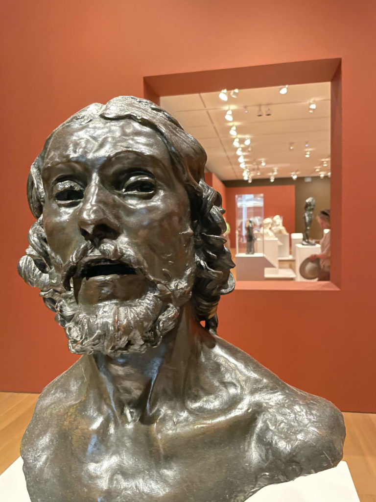 A head of John the Baptist looks toward visitors entering 'Rodin in the United States' at the Clark Art Institute.