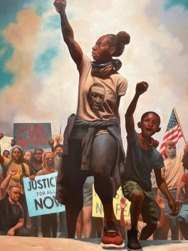 Women speak at a protest with their arms high in Kadir Nelson's American Uprising. Press image courtesy of the Norman Rockwell Museum