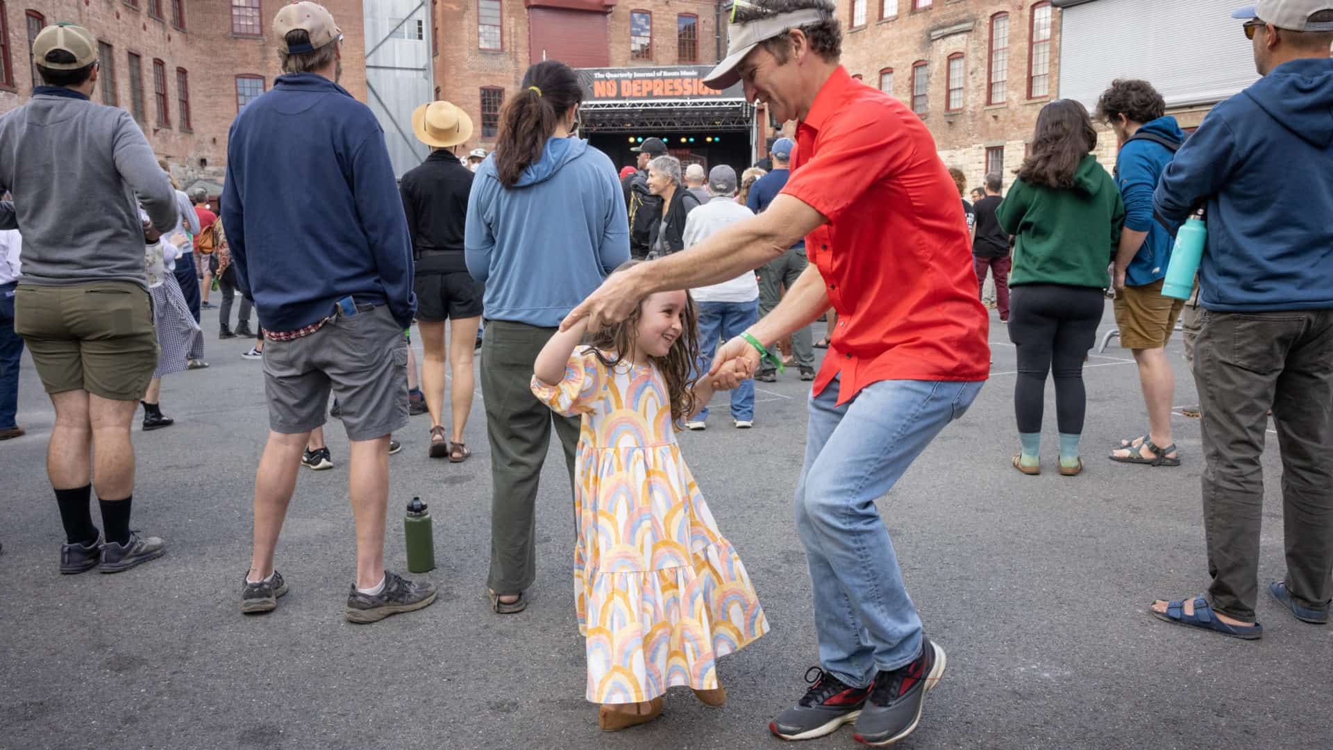 Families dance in the courtyards at FreshGrass 2021. Press photo courtesy of Mass MoCA.