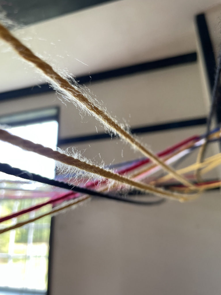 Internationally known Korean artist Kimsooja creates a community art installation with woven thread in the Shaker meetinghouse.