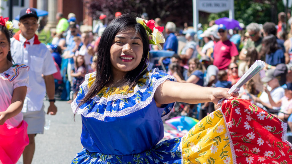 A dancer spins in a bright skirt, performing at the Berkshire Festival Latino. Press photo courtesy of Railroad Street Youth Project