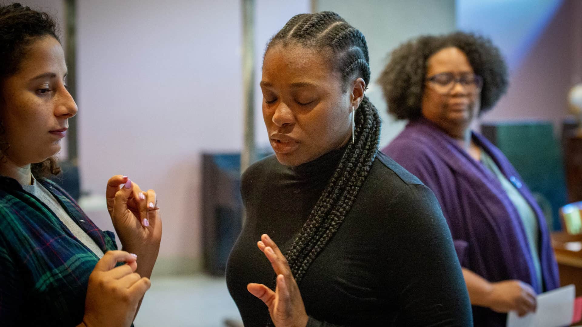 Alicia M. P. Nelson listens as Kyra Davis makes a strong point and MaConnia Chesser takes in the conversation in Cadillac Crew with WAM Theatre. Press photo courtesy of the theater
