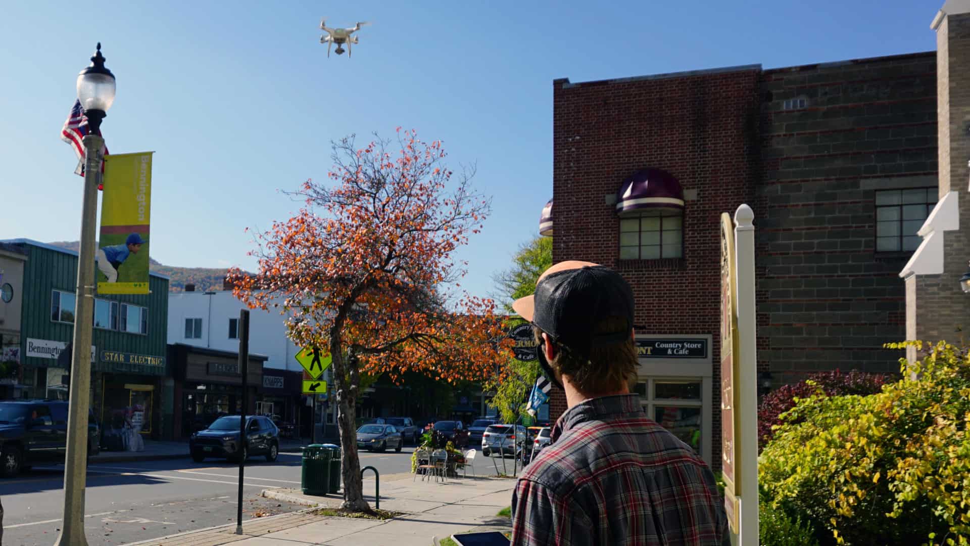 A photographer flies a drone in downtown Bennington, Vt. Press photo courtesy of the Southwestern Vermont Chamber of Commerce