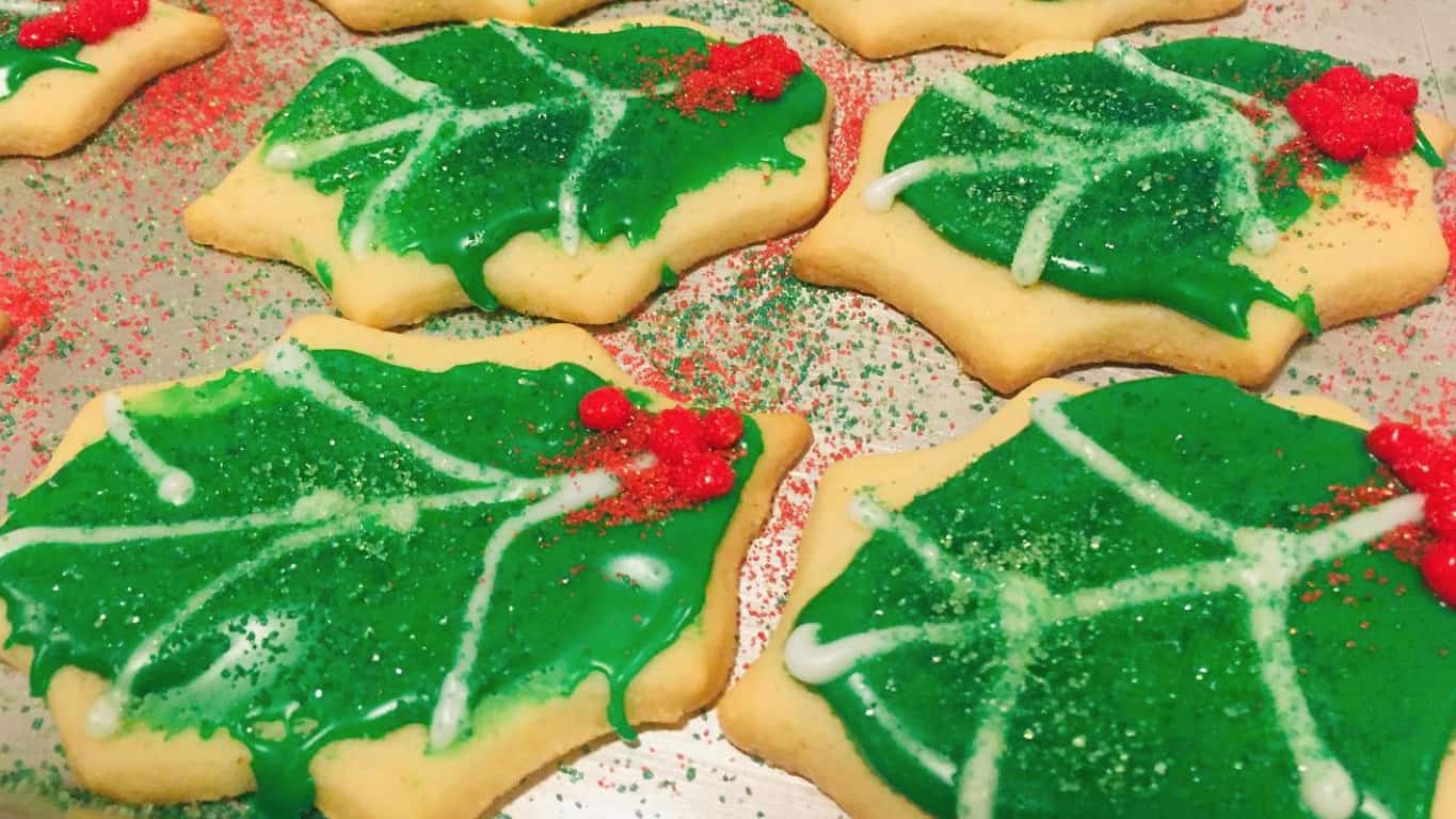 Sugar cookies shaped like holly leaves show holiday color. Press photo courtesy of the artist