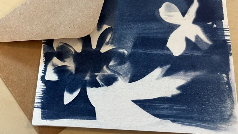A deep blue cyanotype rests on an envelope. Press image courtesy of the Berkshire Arts Center