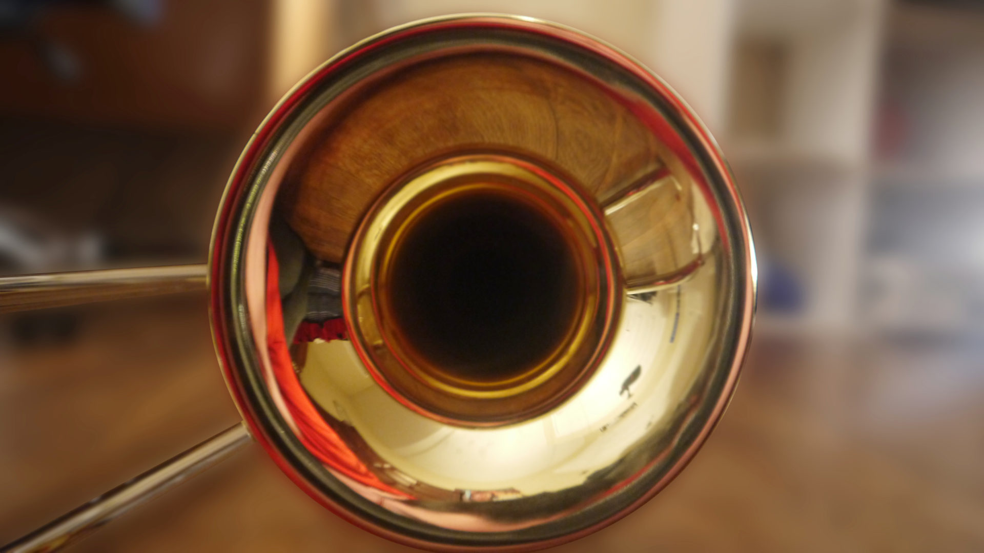 The bell of a trombone gleams in the light. Creative Commons courtesy photo
