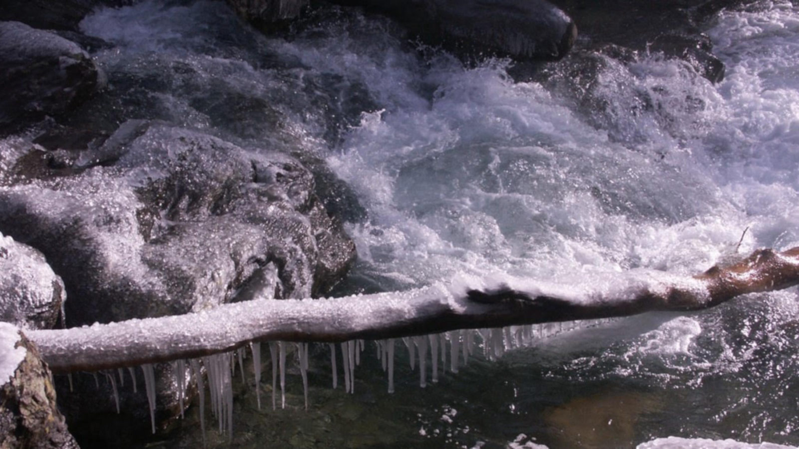 Ice caps foaming water at Bash Bish Falls.