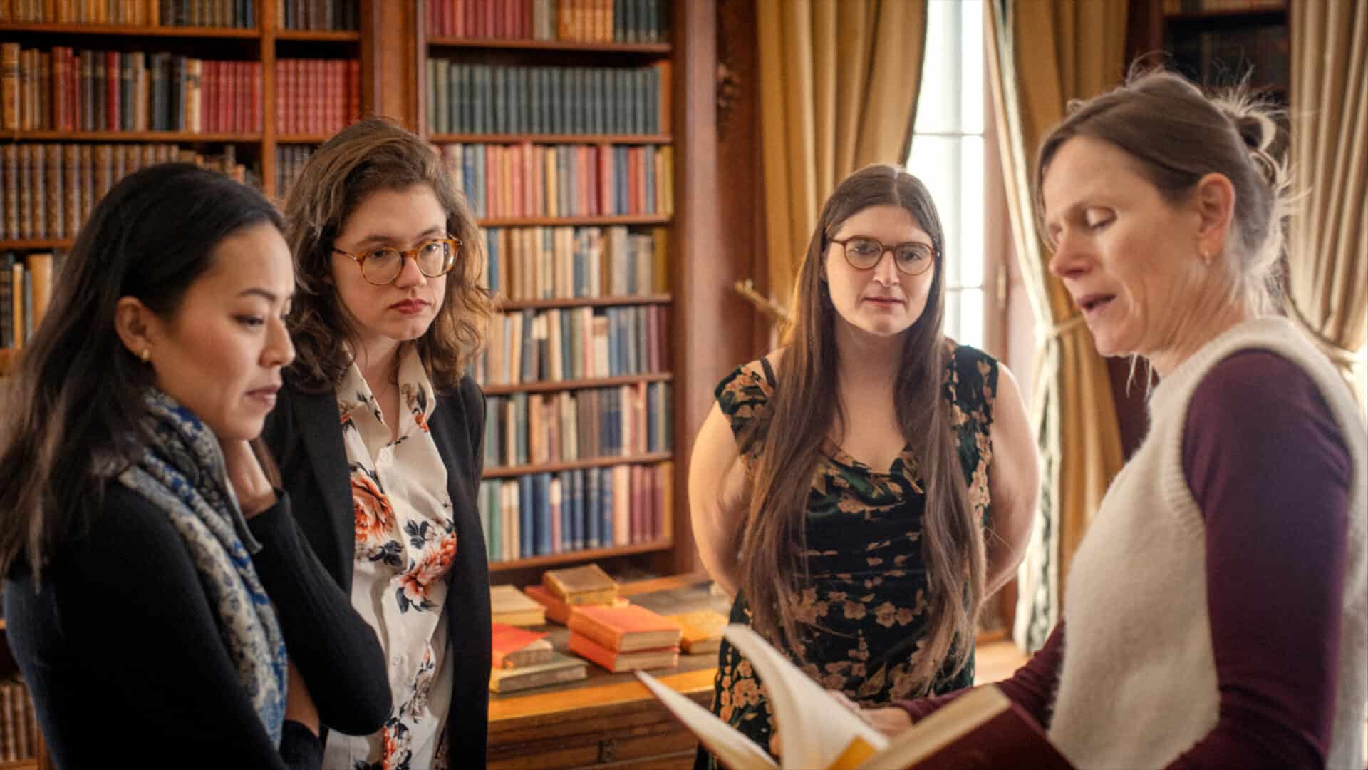 Martha Pham, Emily Atkinson and Emily Kiernan talk with Nynke Dorhout in Edith Wharton's library. Press photo courtesy of the Mount.
