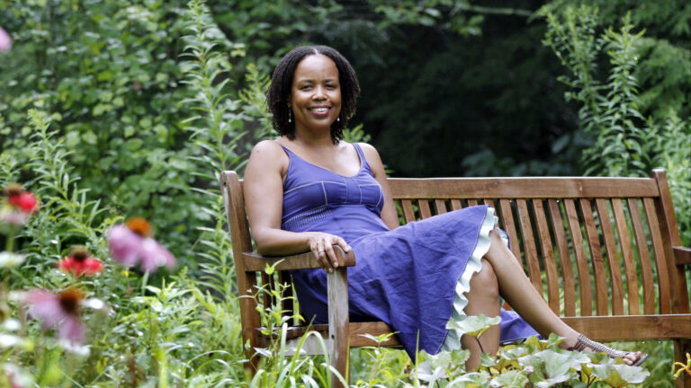Saidiya Hartman in sits her garden at home in Monterey on a sunny day. Photo by Lindsey Zollshan, courtesy of the Berkshire Eagle.