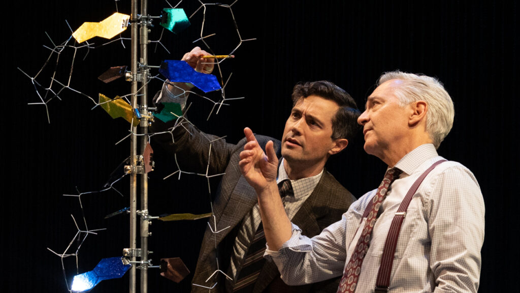 Allen Tedder, Christian Coulson and David Adkins look at a model of a double helix in Photograph 51, 2023. Press photo courtesy of Berkshire Theatre Group