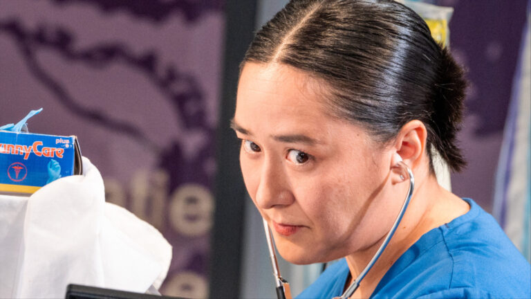 Jennifer Ikeda looks across the stage as the doctor in tiny father, a world premiere play by Mike Lew, at Barrington Stage Company. Press photo courtesy of BSC.