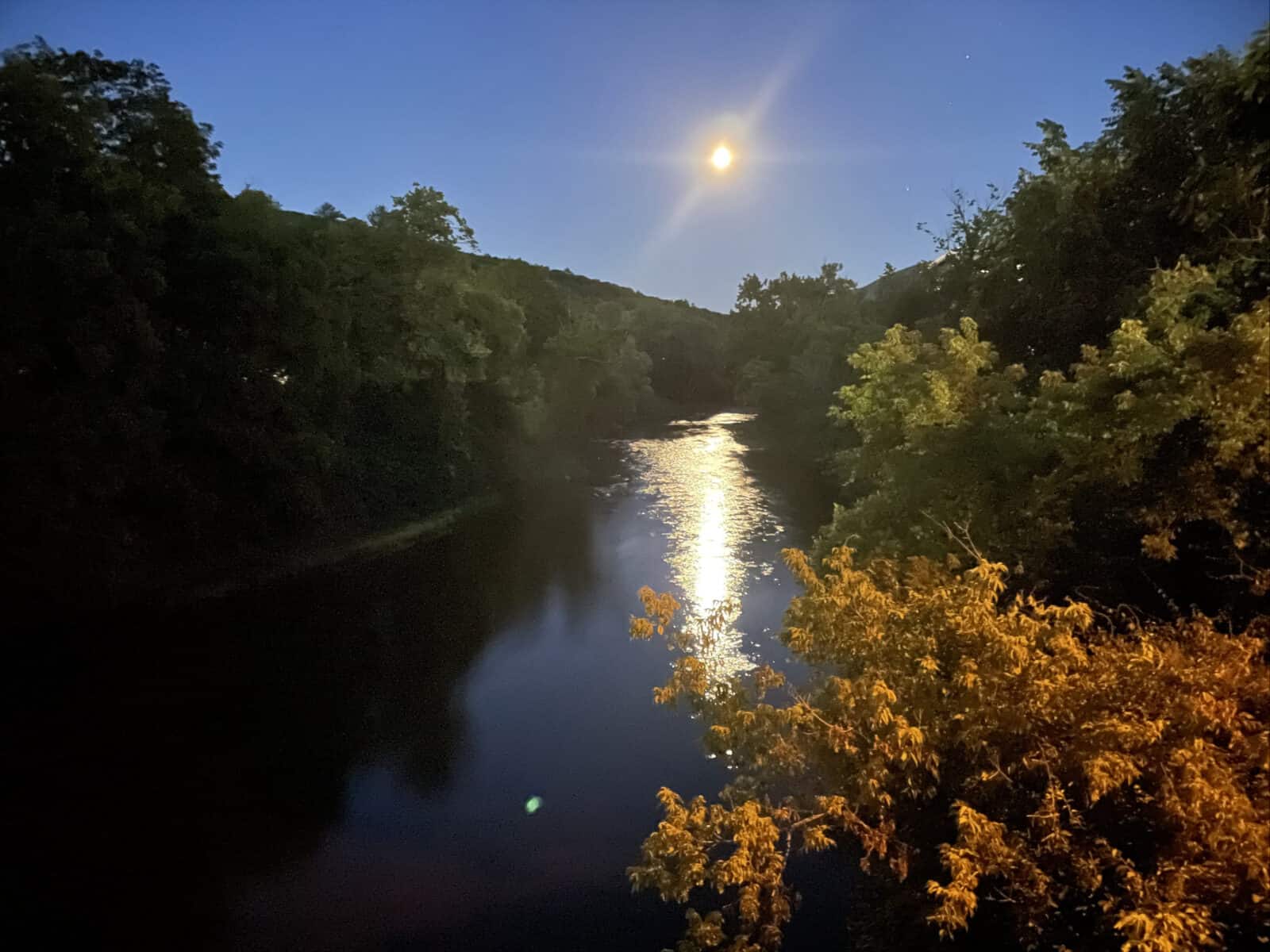 The Hoosic River glows under a full moon on the summer solstice.