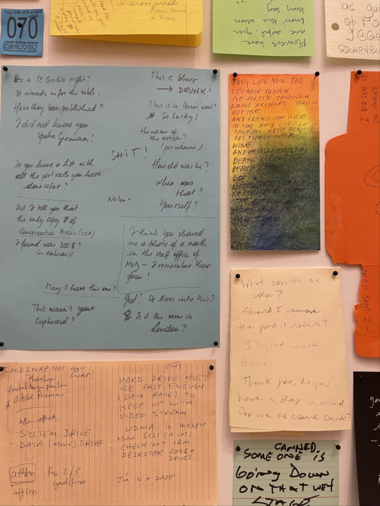 Joseph Grigely lines the walls of a round room with bright scraps of paper, notes people have written to him because they don't speak sign language, in 'In What Way Wham? White Noise and Other Works' at Mass MoCA.