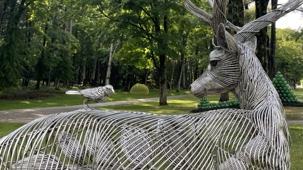 Byeongdoo Moon's metal sculpture, a stag with antlers growing into limbs and leaves, gleams at the Mount.