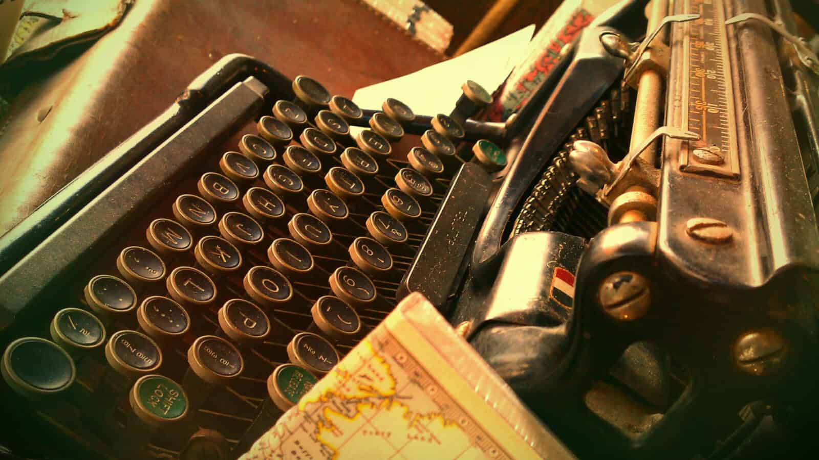 A typewriter reclines on a desk among old maps and books at a stationery shop in Brunswick. Creative Commons courtesy photo