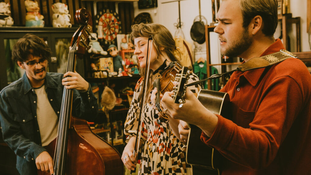Noah and Chloe Gose on guitar and violin and Andrew Vaggalis on bass perform as the Wildwoods, a folk / Americana trio from Lincoln, Nebraska