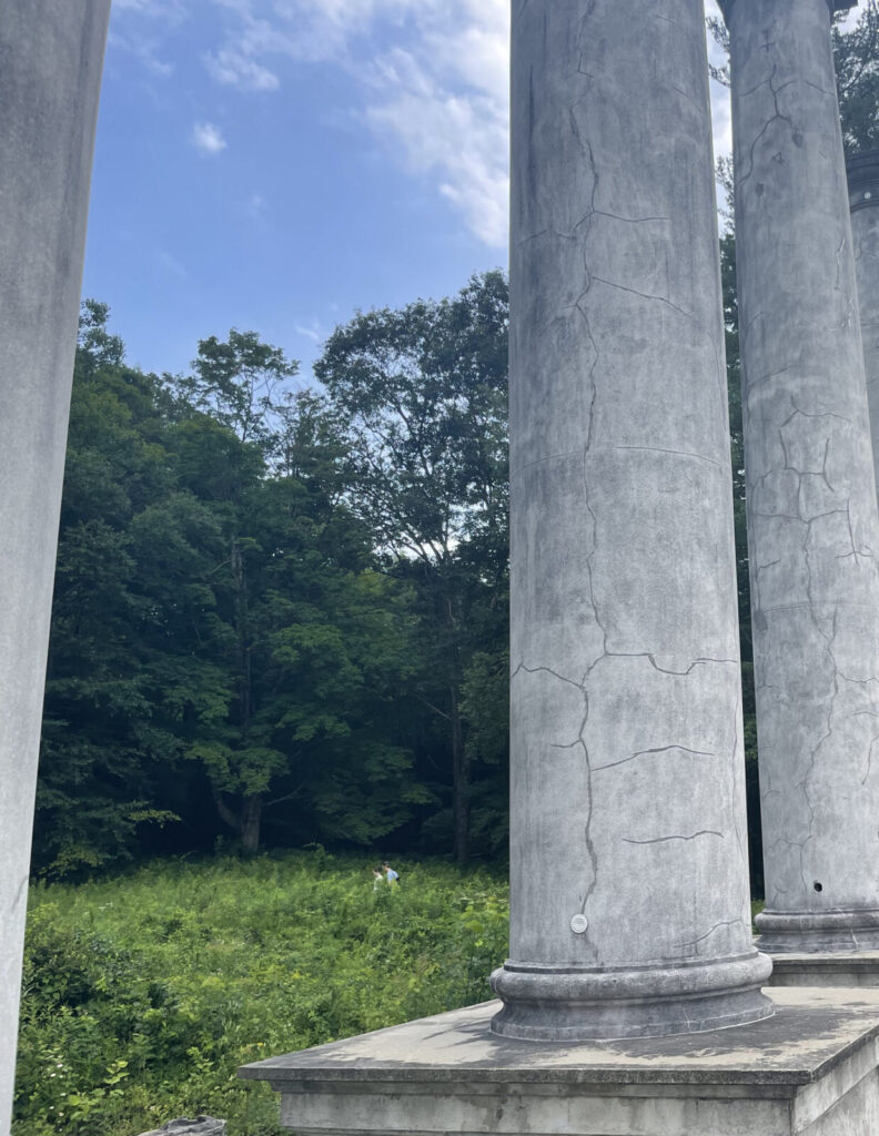 The columns of a Gilded Age house stand alone on the hilltop at Ashinully.