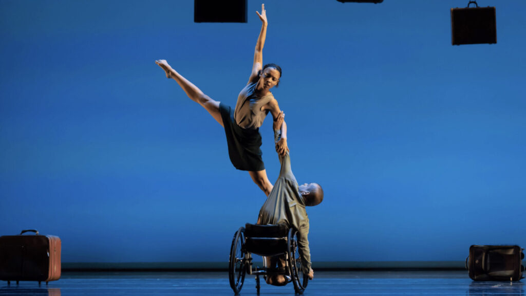 AXIS Dance Company's Alaja Badalich and Janpi Star perform, one dancer in a wheelchair holding another in the air. Press photo courtesy of Jacob's Pillow Dance Festival