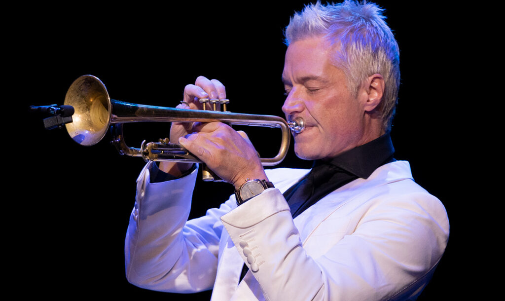 Grammy Award-winning master trumpeter and composer Chris Botti holds a long note with his eyes closed. Press photo courtesy of the Mahaiwe