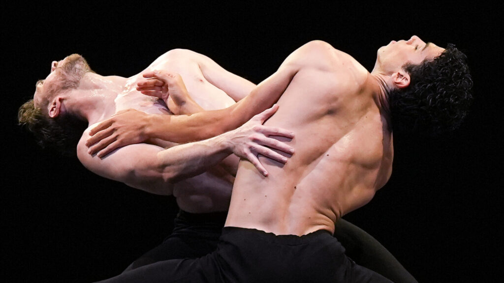 Timothy van Poucke and James Stout curve close together in Two and Only with the Dutch National Ballet.