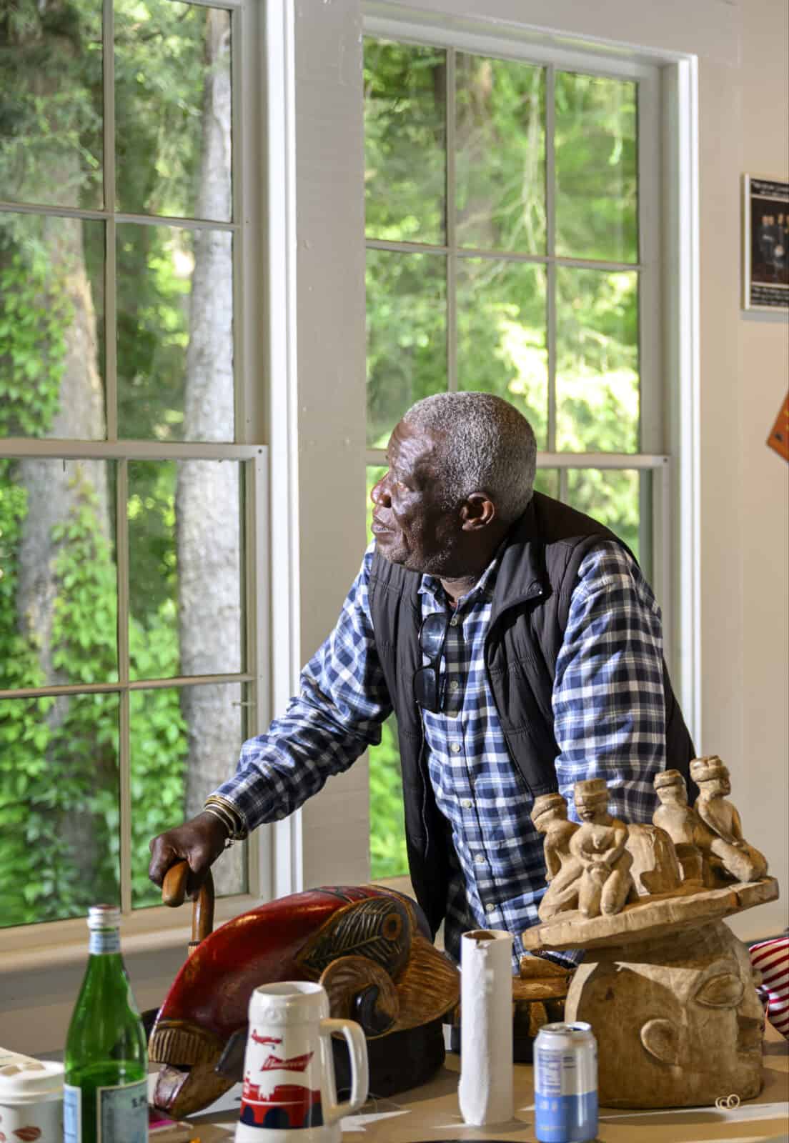 Internationally acclaimed artist Georges Adéagbo looks around the Morris Studio as he creates a site-specific art installation. Press photo courtesy of Chesterwood.